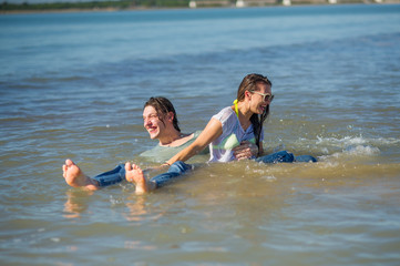 Young couple bathing in the sea.