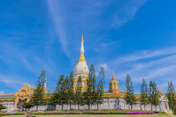 Naklejka premium The sanctuary at Wat Phra Maha Chedi Chai Mongkol ,Roi Et province, Thailand with the beautiful sky and cloud.The public properties.