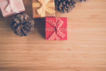 present boxes and pine cone. gift box for xmas party. christmas and new year holiday celebration.