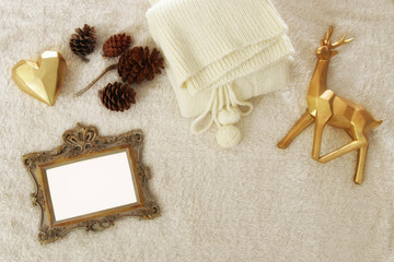 Empty wooden photo frame over cozy and warm fur carpet. For photography montage. Top view.