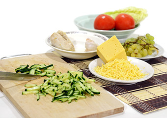 Sliced cucumber to prepare the vegetable salad with boiled chicken