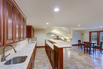 Wedding venue interior features white kitchen and dining area