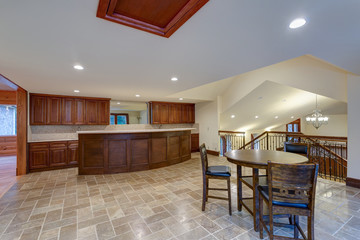 Wedding venue interior features white kitchen and dining area
