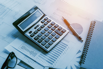 Naklejka na ściany i meble business accounting concept financial with calculator pen notbook on desk