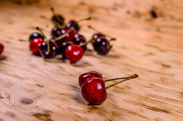 Fresh ripe cherries on wooden table