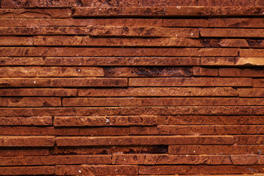 Dark Brown Texture Of A Stone Wall.