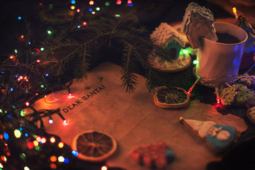 Letter for Santa on decorated chrismas background with gingerbread coocies and garland
