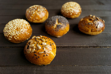Bagels with seeds on a black background.