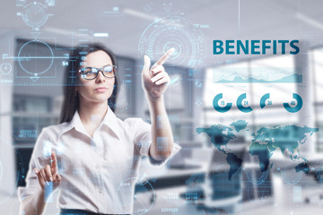 The concept of business, technology, the Internet and the network. A young entrepreneur working on a virtual screen of the future and sees the inscription: Benefits