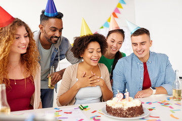 team greeting colleague at office birthday party