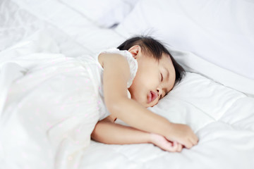 Obraz na płótnie Canvas baby sleeping on bed at home