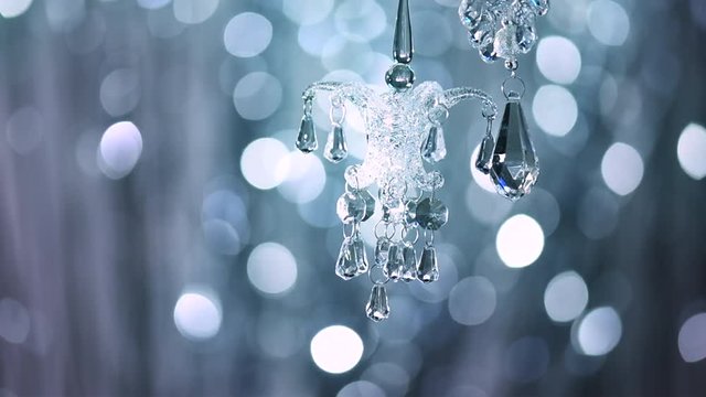 Christmas and New Year glass decoration over blinking holiday silver background. 4K UHD video footage. Ultra high definition 3840X2160