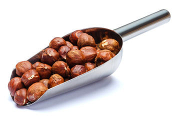 Scoop full of hazelnuts isolated on white background. Clipping path