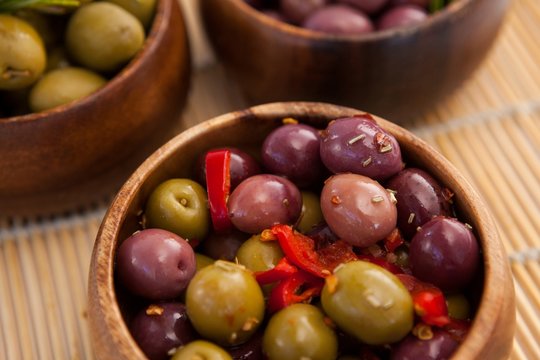 High angle view of olives in wooden container