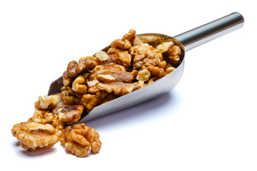 Scoop of Roasted walnuts isolated on white background. Clipping path