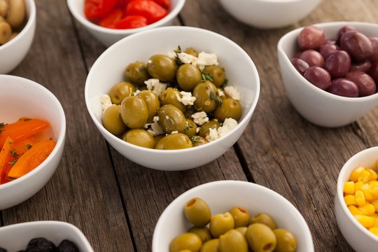 Various olives and ingredients in bowls