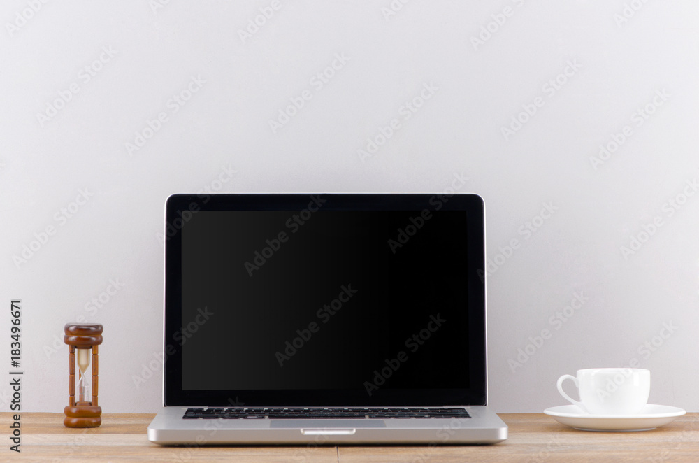 Poster laptop computer white blank screen on work table front view