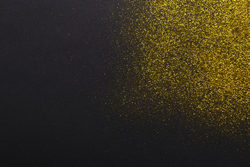 Fototapeta na wymiar Golden glitter sand texture, abstract background.