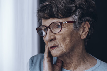 Elderly woman's face with glasses