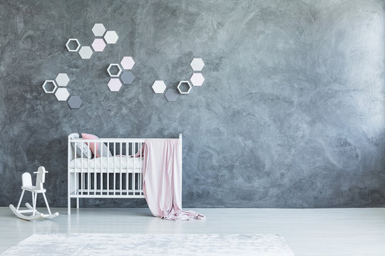 Grey baby's room with honeycombs