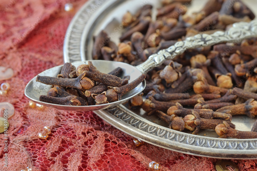 Wall mural cloves on spoon and metal plate