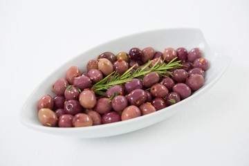 Olives garnished with rosemary