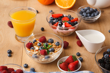 Rich breakfast on natural wooden table