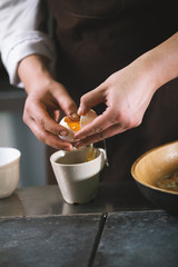 The chef separates the whites then yolks in restaurant