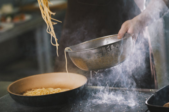 Cooking Spaghetti In Restaurant