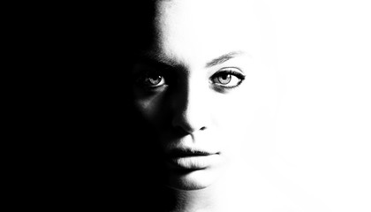 High contrast black and white portrait of a beautiful girl.