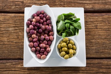 Marinated olives with herbs in bowl