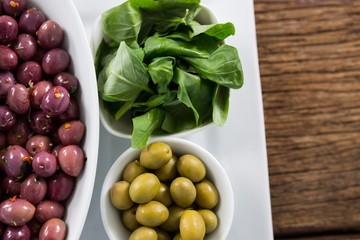 Marinated olives with herbs in bowl