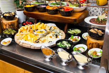salads and cheese sliced on the morning table