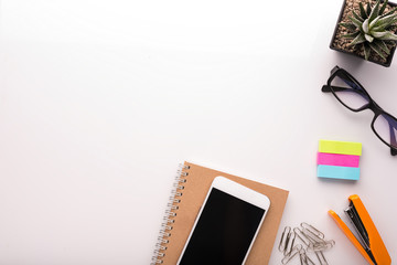 White office desk table with school accessories with office supplies. Top view with copy space