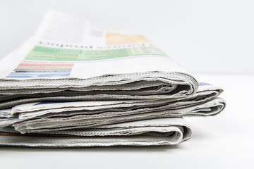 Newspapers folded and stacked