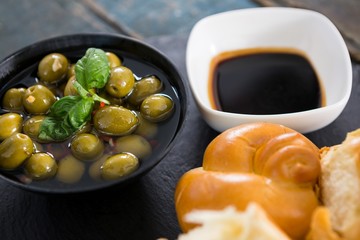 Marinated olives with bread pieces and olive oil