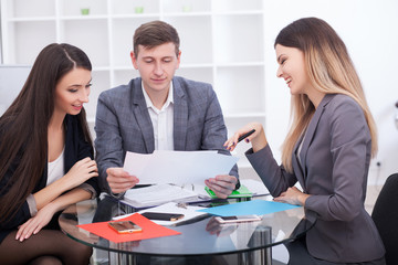 Business Team Meeting. Man Making Presentation In Office And Training Colleagues. Business People Sitting At Conference Table, Working On Project And Brainstorming Together. High Quality Image.