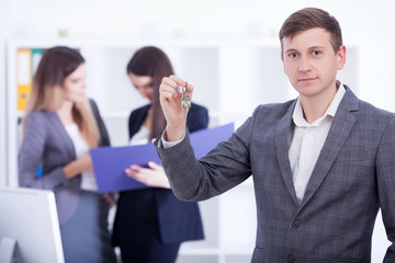 Business Team Meeting. Man Making Presentation In Office And Training Colleagues. Business People Sitting At Conference Table, Working On Project And Brainstorming Together. High Quality Image.