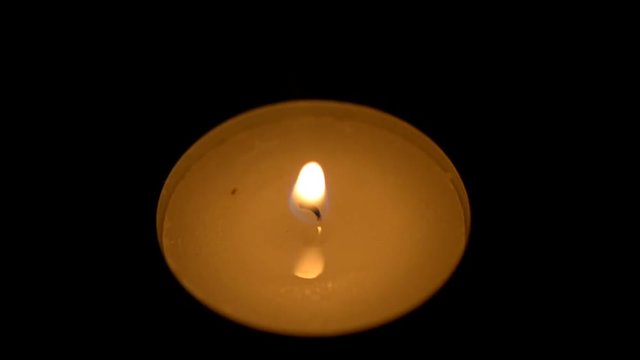 burning an aromatic candle in the dark