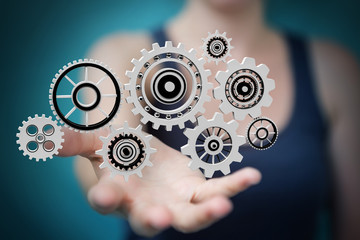 Businesswoman using floating gear icons 3D rendering