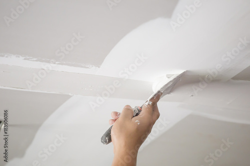 Hands Of The Ceiling Technician Stock Photo And Royalty