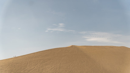 Fototapeta na wymiar Huacachina desert and dunes of sand in Ica region, Peru.