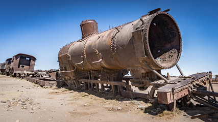 Fototapeta na wymiar Rusty old train at the Train Cemetery in Uyuni desert, Bolivia, South America