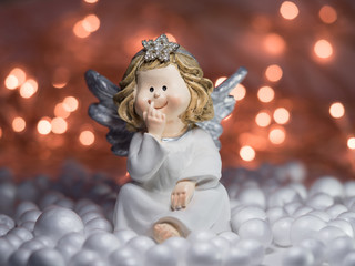 Christmas angel with shiny star on a twinkle background
