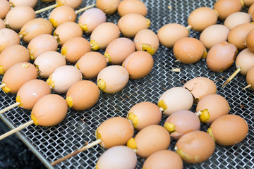 Grilled eggs at street food in Thailand