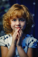 close-up portrait of a little blonde new year