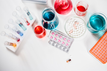pills and test tubes in laboratory. drug discovery, pharmacology and biotechnology concept. science...