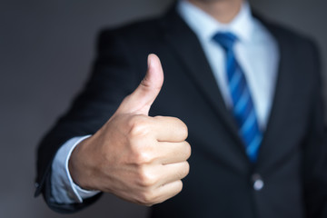 Businessman showing thumbs up - closeup shot