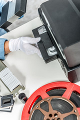technician with VHS cassette for digitization