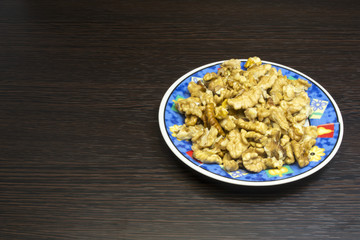 Plate with peeled walnuts